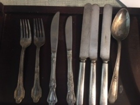 A collection of old silverware.