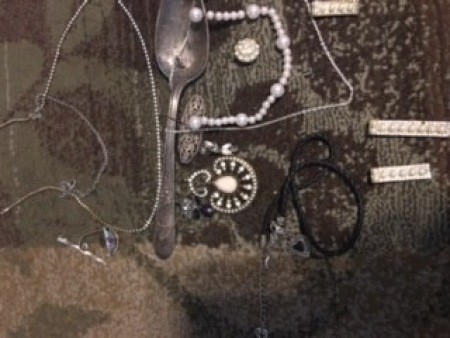 A collection of jewelry and silverware.