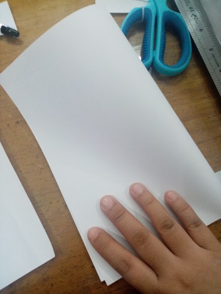 Folding a piece of paper in half.