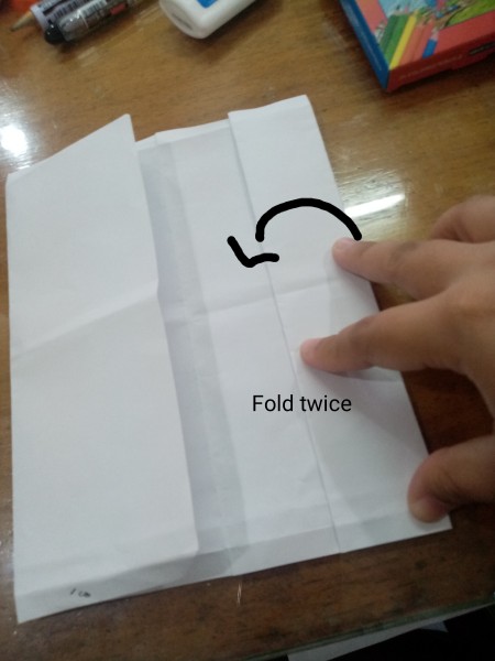 Folding the paper.