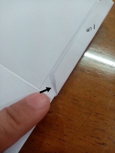 Folding the paper.