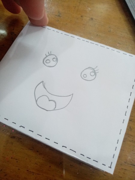 creating a smiley face on the wallet.