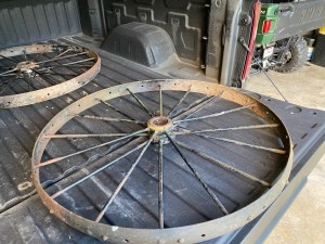 A pair of old metal spoked wheels.