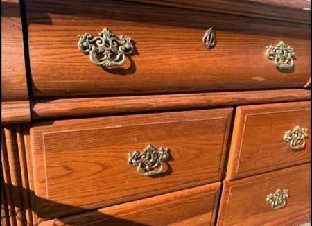 A close up of a wooden dresser.