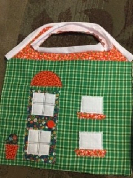 Assembling the fabric playhouse.