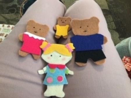 Small felt dolls of Goldilocks and the Three Bears.