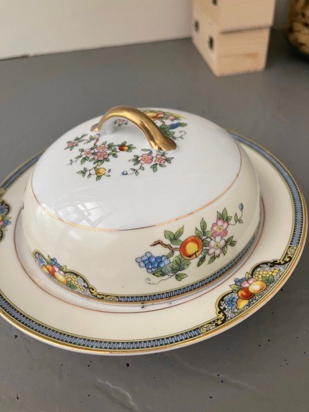A china serving dish with a lid.