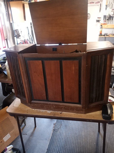 A wooden record player cabinet.