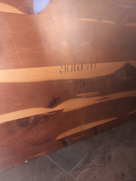 Markings on a cedar chest.