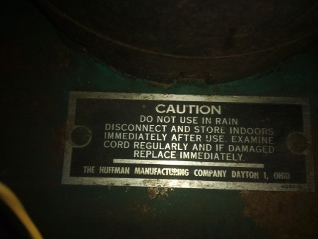 A caution warning on a lawn mower.