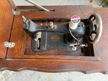 The top of an old treadle sewing machine.