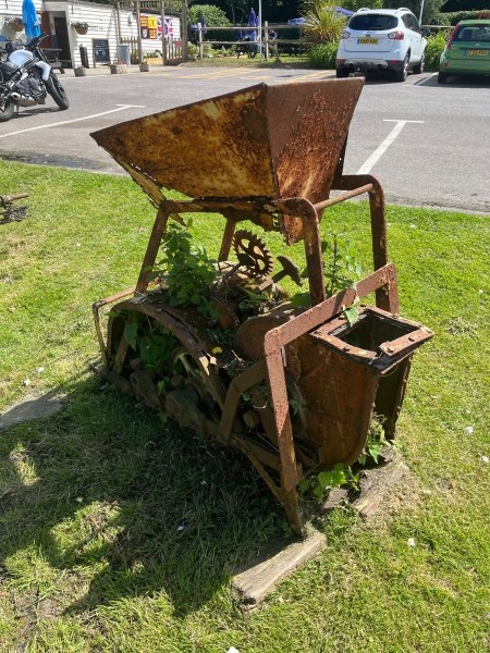 An old rusted piece of farm equipment.