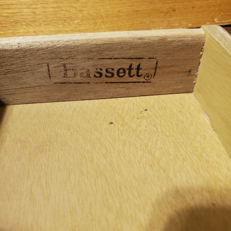 The Bassett logo inside a drawer.
