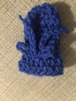 A crocheted doggie shoe.