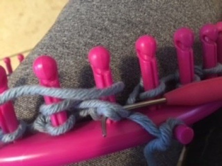 Using the loom to make the bag.