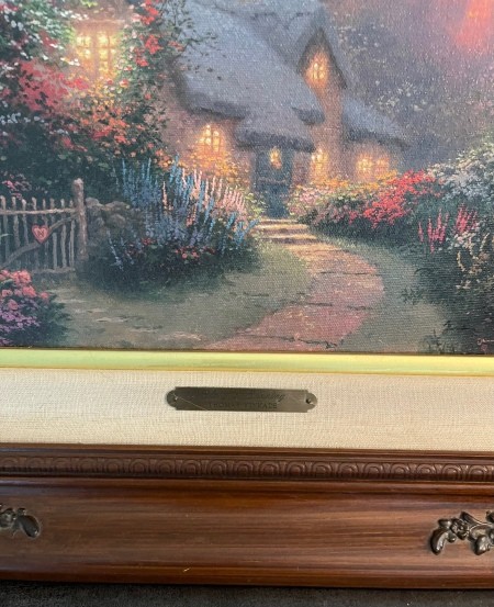 The brass label on the artwork.