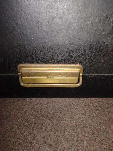 A closure on a portable radio.