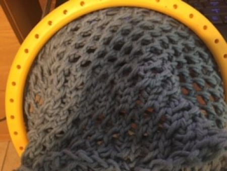 Using the loom to make the bag.