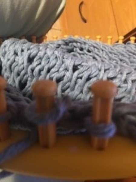 Using the loom to make the bag.