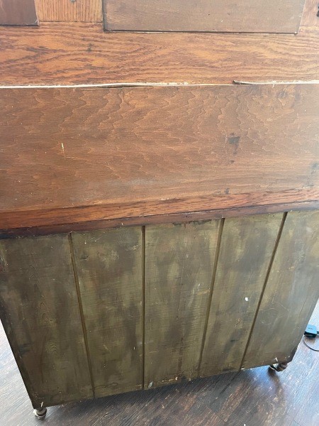 The back of a wooden dresser.
