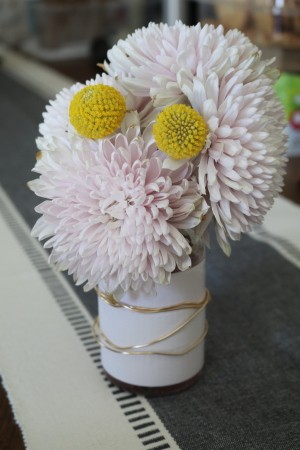 The finished vase filled with flowers.