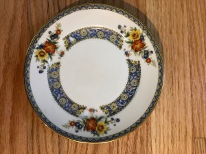 A china plate with a floral border.