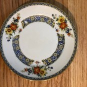A china plate with a floral border.