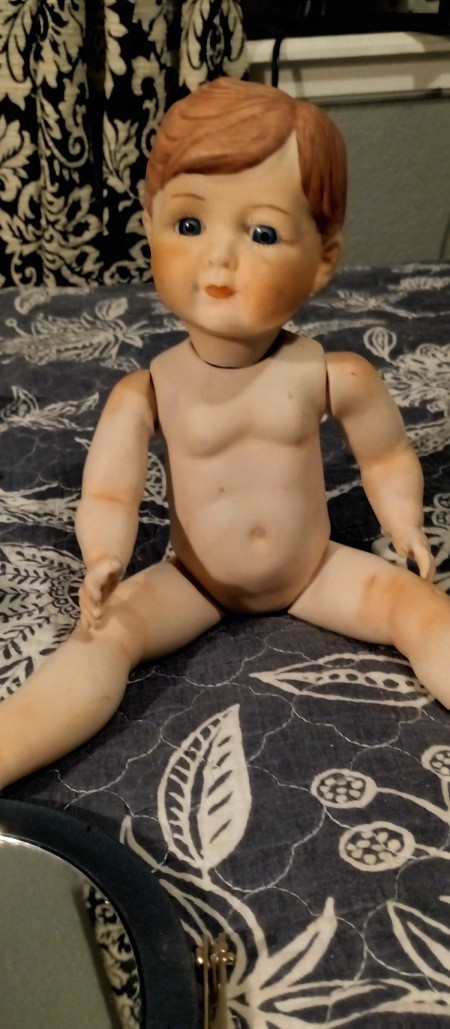 An old posable doll toy.
