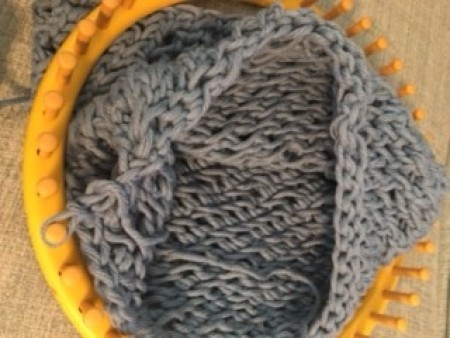 Using the loom to make the bag.