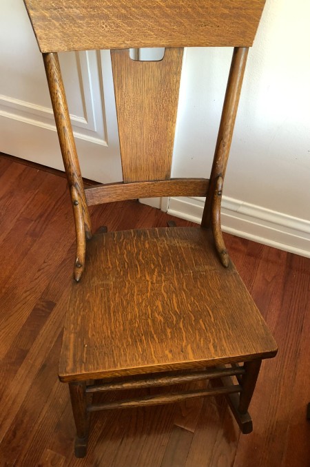 A wooden rocking chair.