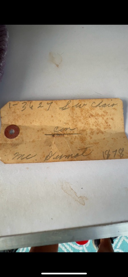 A hand written tag found on the chair.