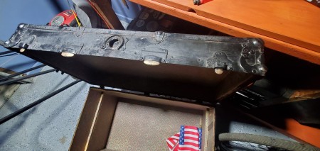 The open lid of the steamer trunk.
