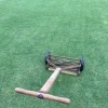 An old fashioned reel mower.