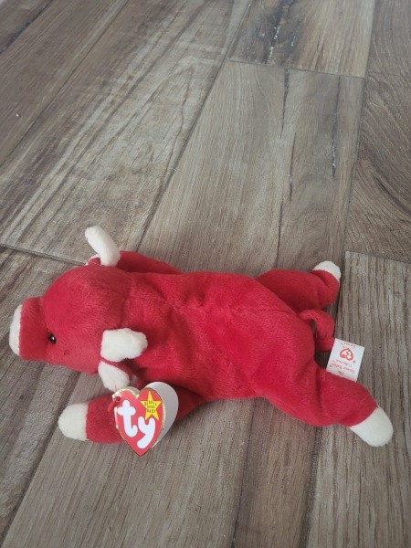 A Beanie Baby bull stuffed toy.
