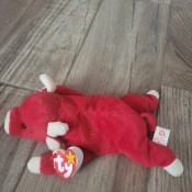 A Beanie Baby bull stuffed toy.
