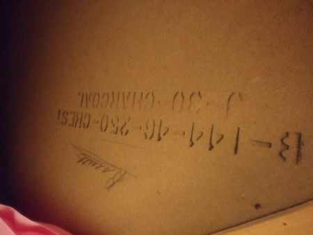 Marking on the back of a vintage dresser.
