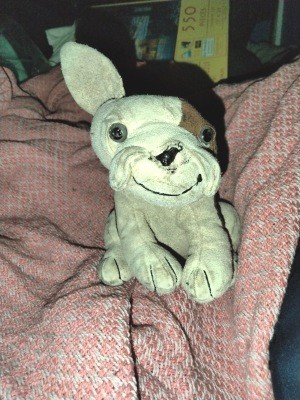 A brown and beige stuffed dog.
