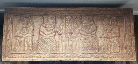 A carved wooden chest.
