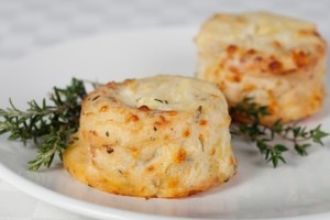 Two small potato soufflés on a plate.