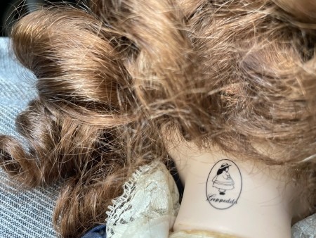 The back of a porcelain doll's neck.
