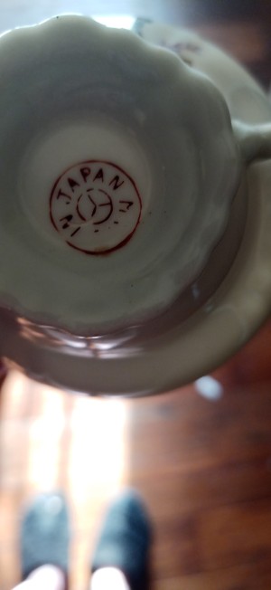 A marking on the underside of a china cup.