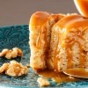 A homemade cake with a caramel topping.