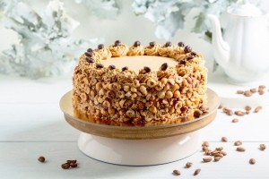 A cake covered with nuts.
