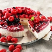 A cake covered with bright berries.