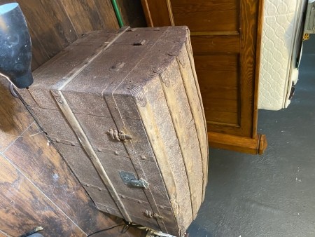 A steamer trunk on its end.