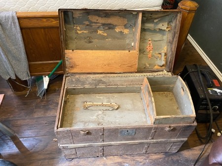the open steamer trunk.