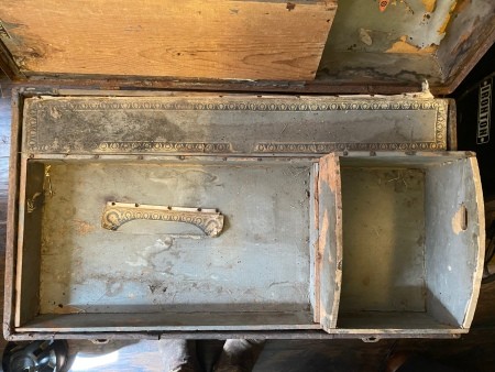 Inside the steamer trunk.