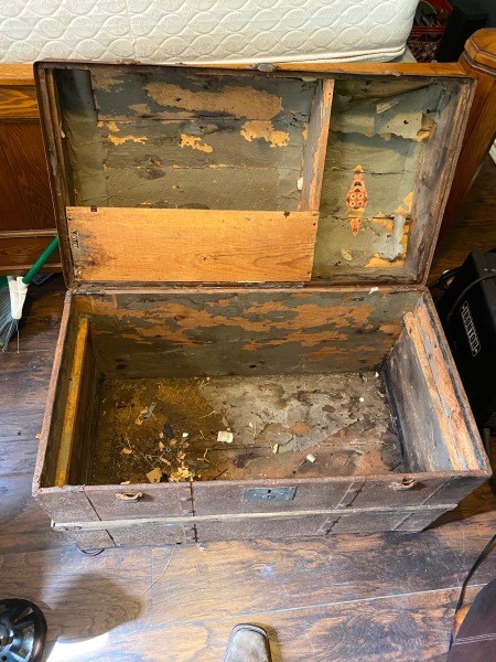 The open steamer trunk.