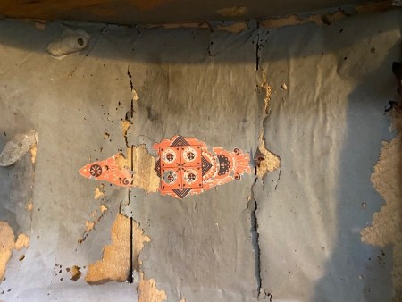 A colorful design on the steamer trunk.