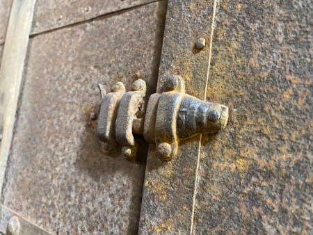 Hardware on a steamer trunk.